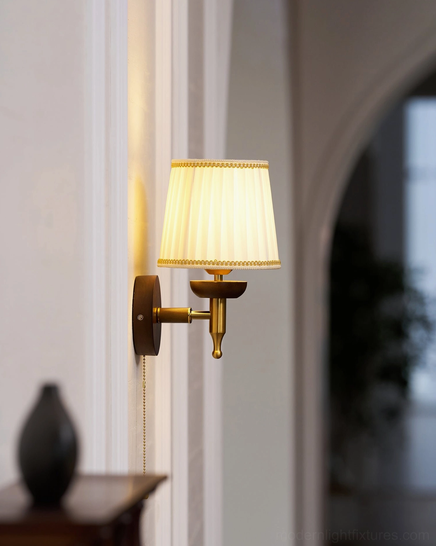 Blixen wall sconce industrial style pairing with exposed brick and metal furnishings