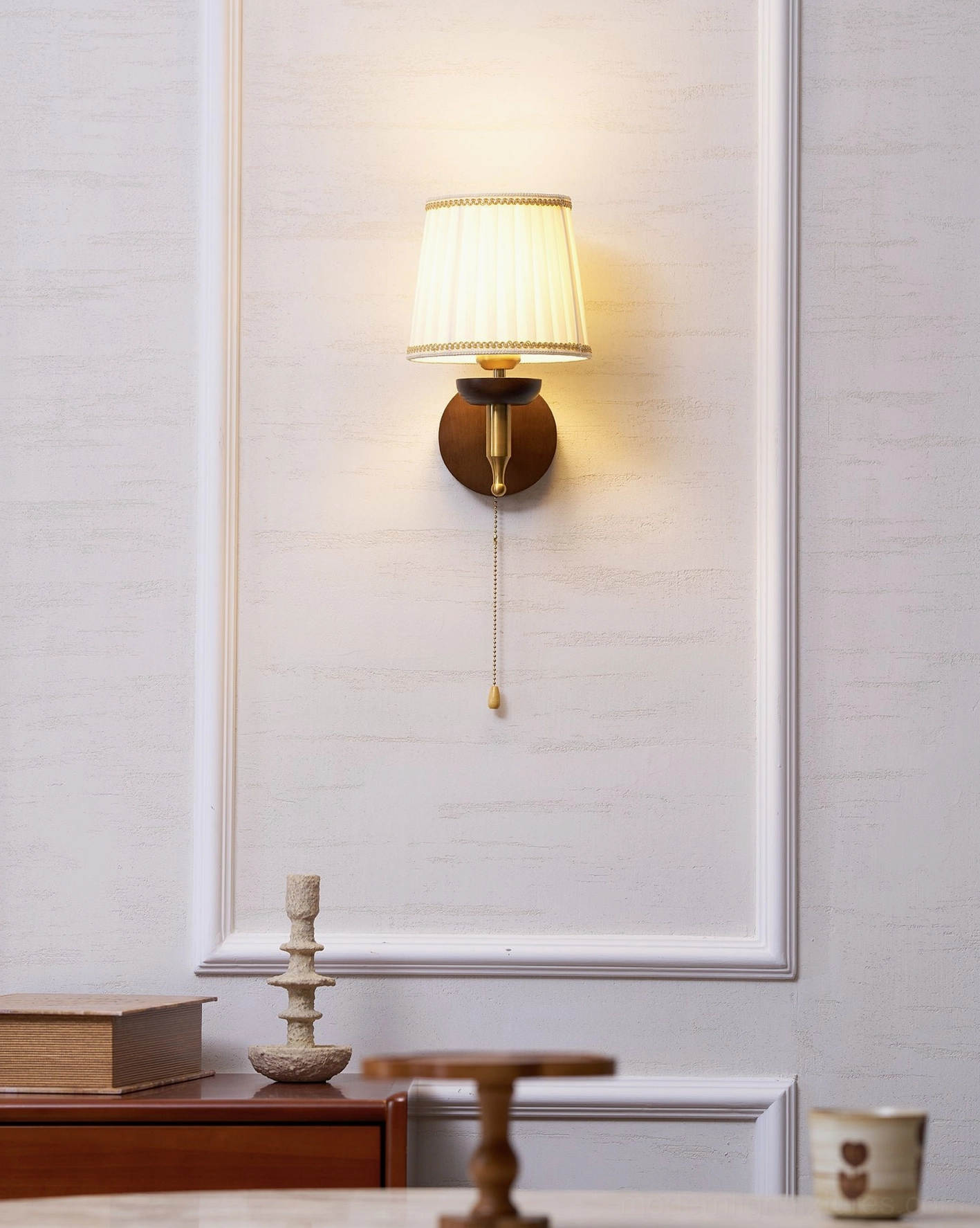 Blixen wall sconce offering layered lighting solutions for living room ambiance