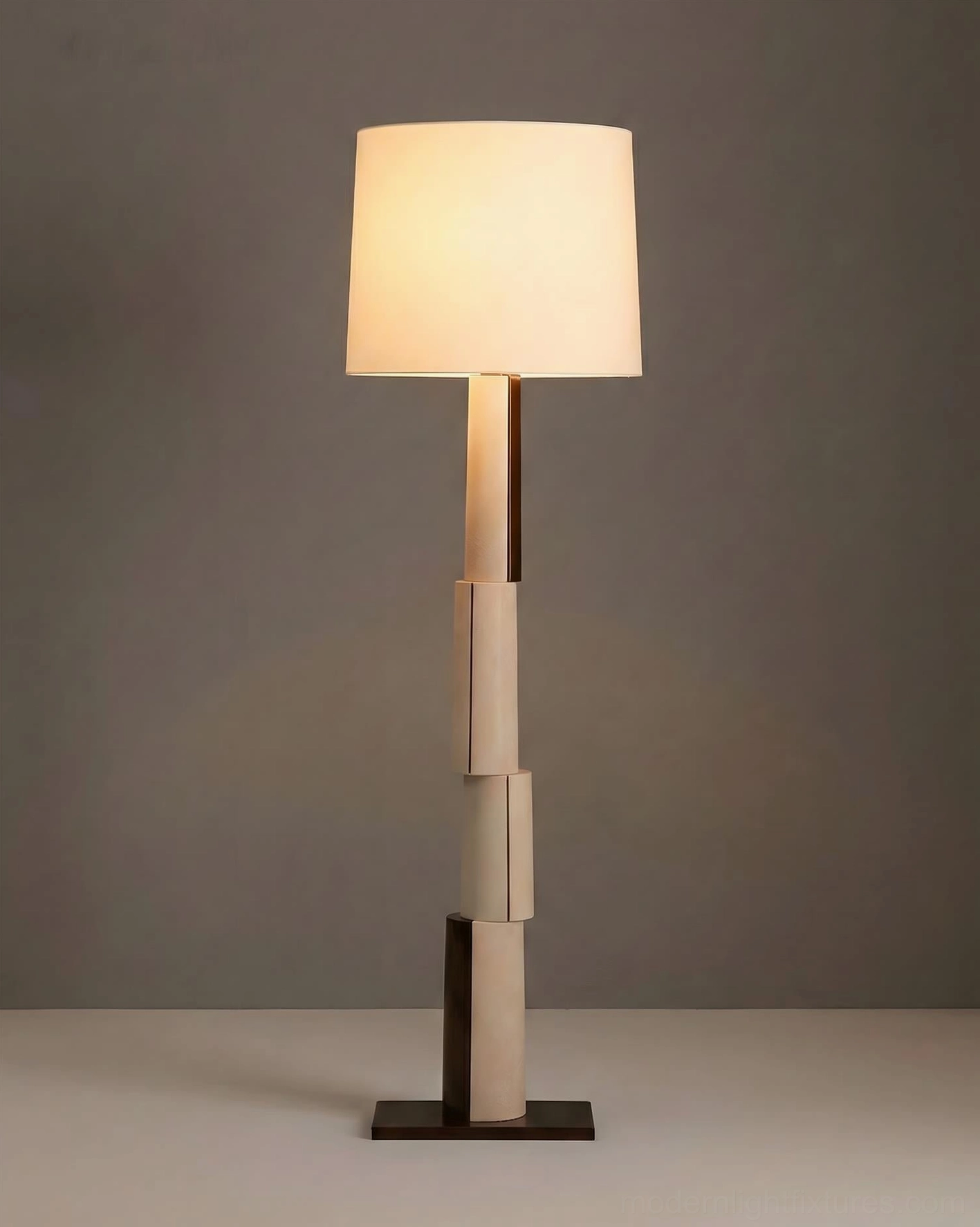 Lit block floor lamp with glowing white fabric shade and segmented pole - contemporary minimalist ambient lighting