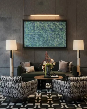 Pair of contemporary block floor lamps in modern living room with green sofa and patterned lounge chairs - luxury interior design styling
