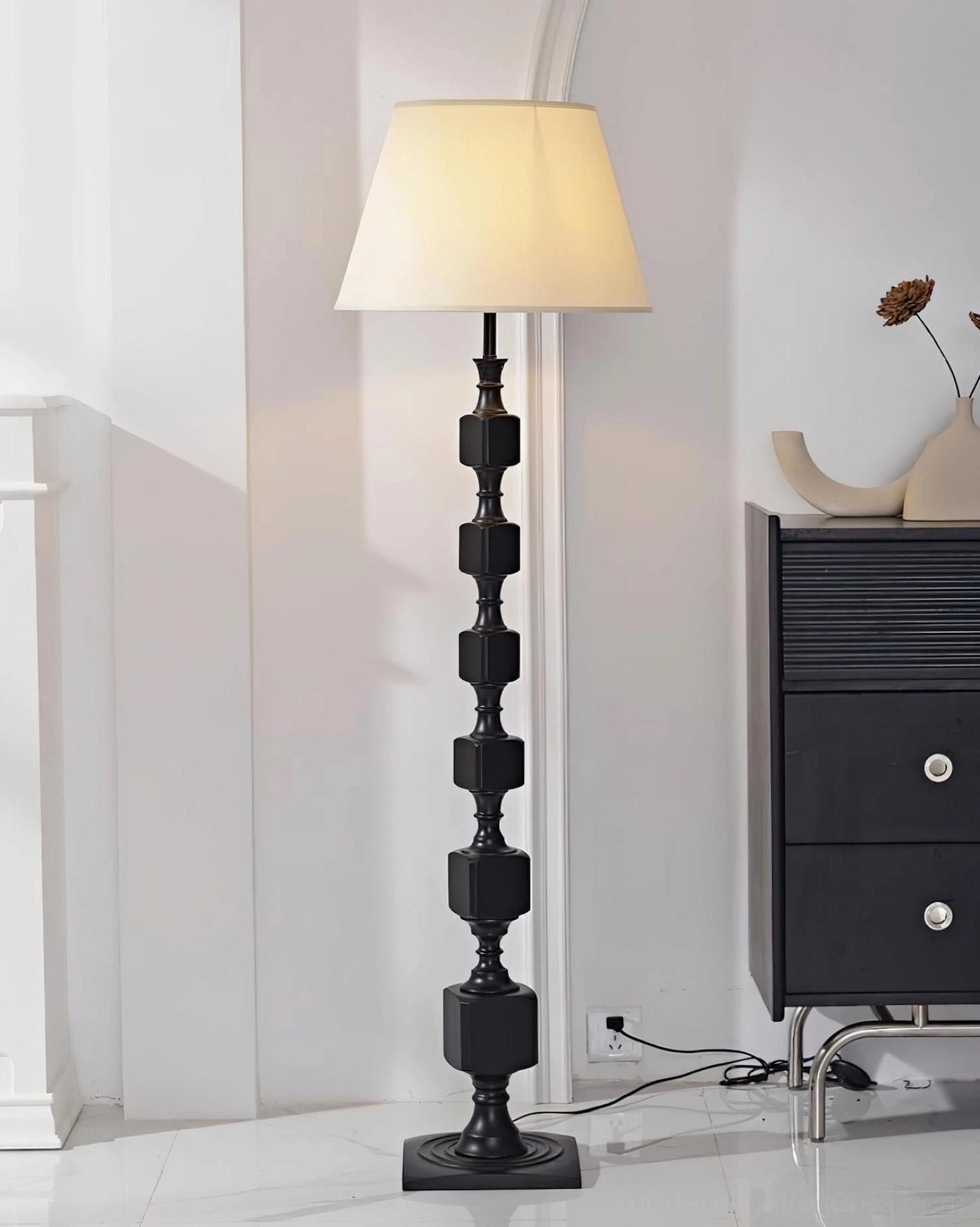 Full-length view of Blockora stacked wood floor lamp showing complete height proportion and sculptural presence in contemporary living space