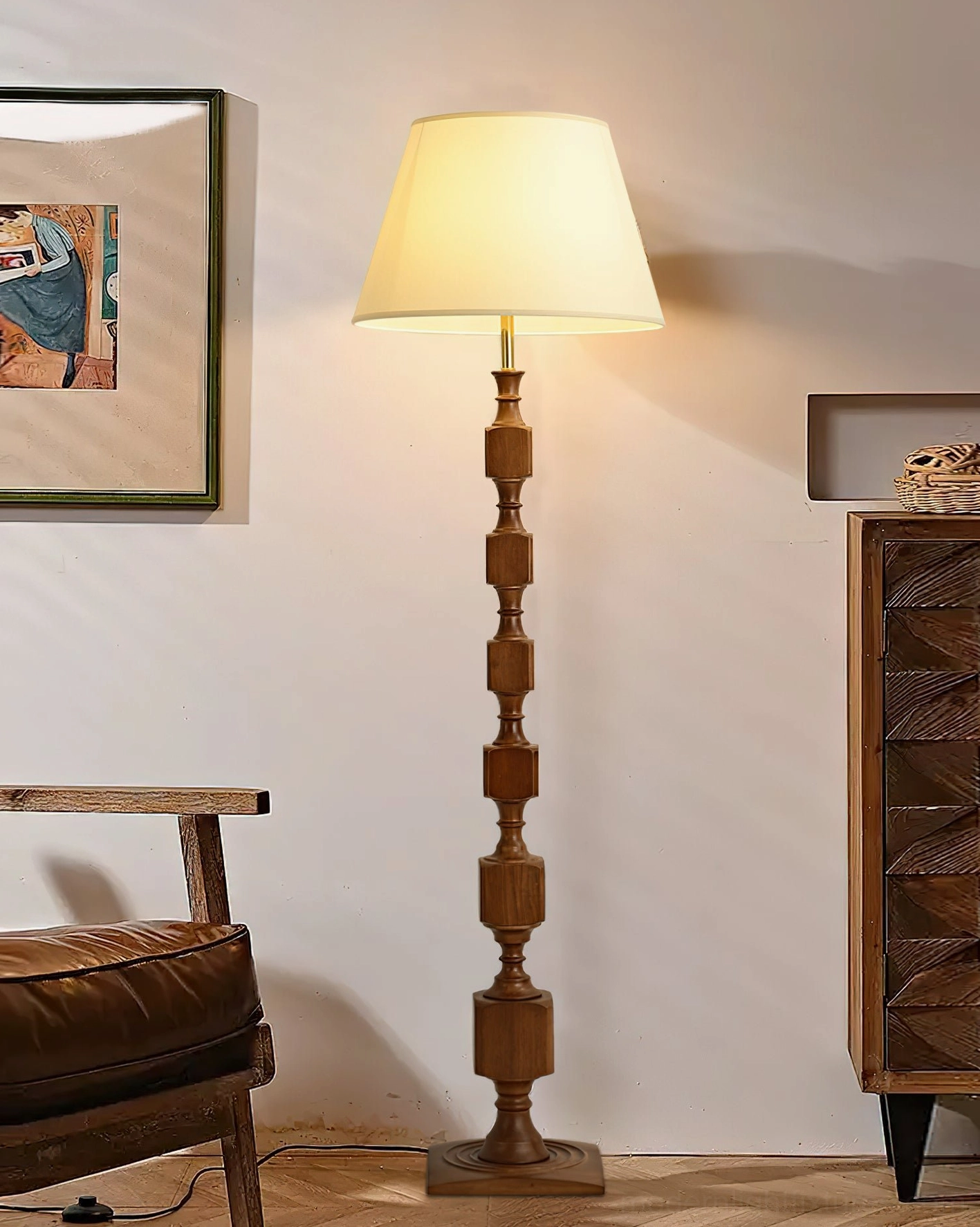 Blockora wooden stacked floor lamp with cream shade positioned in stylish living room with vintage cabinet and artwork, warm rustic aesthetic