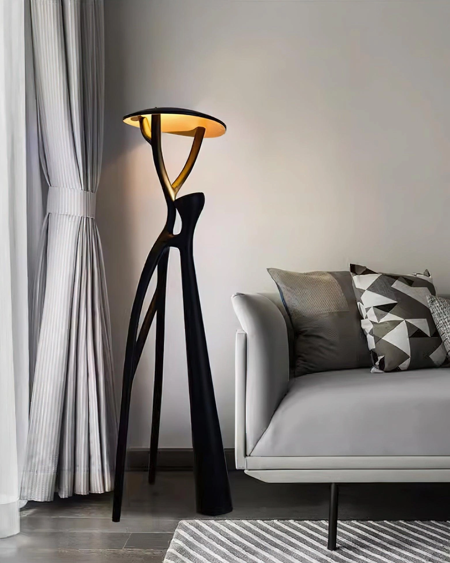Blonski floor lamp with warm ambient lighting in contemporary residential space, matte black finish