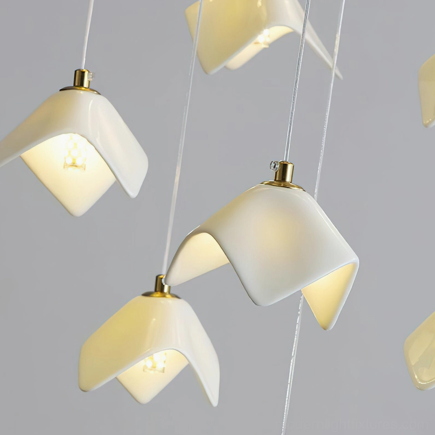 Cascading bloom chandelier installed in contemporary atrium space demonstrating dramatic vertical architectural impact