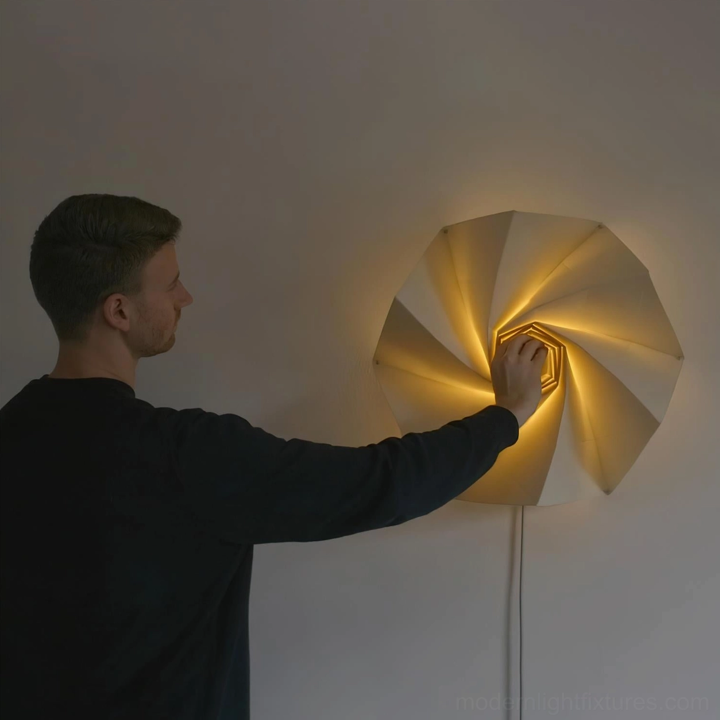 Bloom illuminated wall lamp showing spiral layers and warm 3000K LED light diffusion through fabric shade