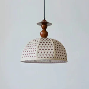 Bloomery pendant light close-up showing off-white shade with brown tulip floral botanical print and wooden accents
