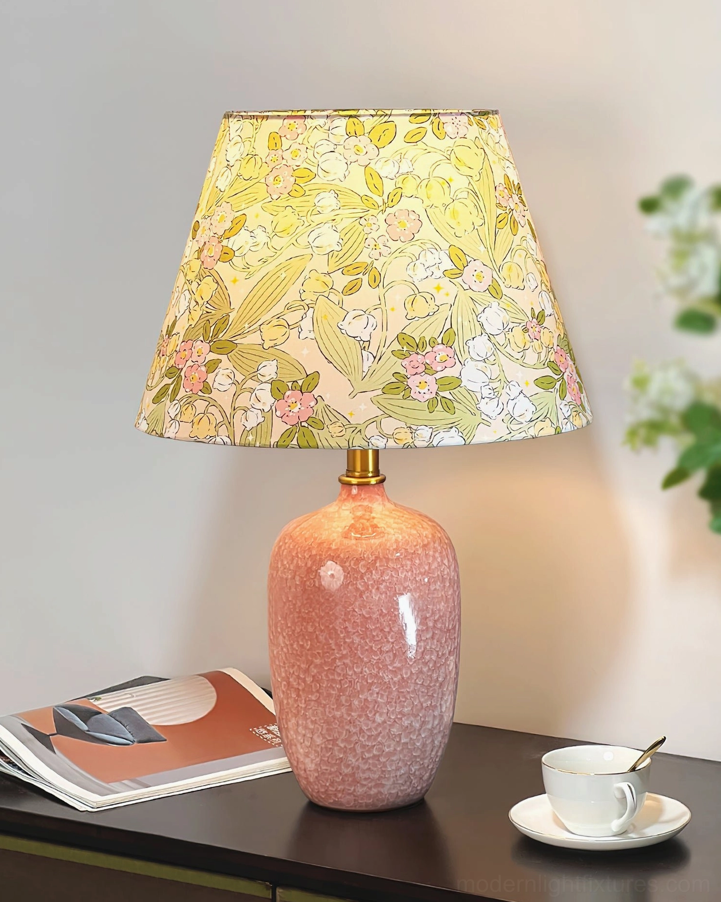 Bloomora ceramic table lamp with pink base and floral shade arranged in living room accent lighting setup