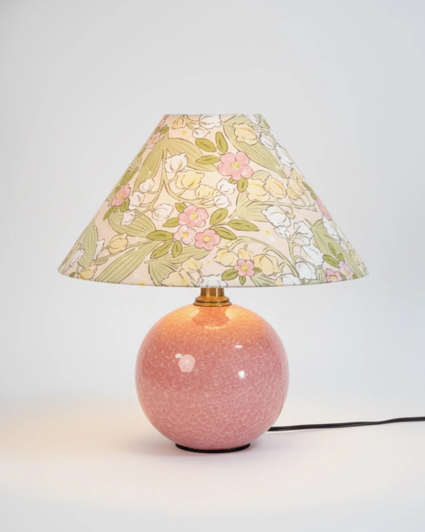 Bloomora ceramic table lamp with floral printed shade and pink glossy base, three-quarter front view with power cord visible