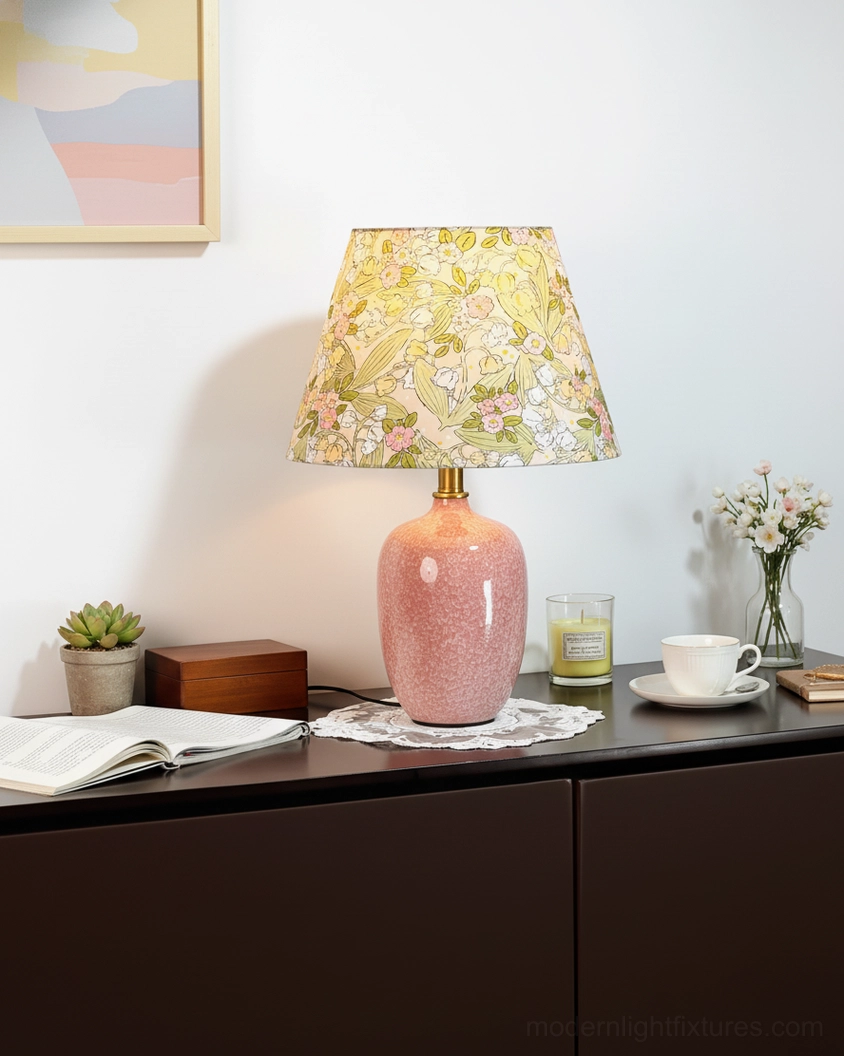 Bloomora ceramic table lamp on home dresser with framed art and succulent, side three-quarter view showing fabric shade detail