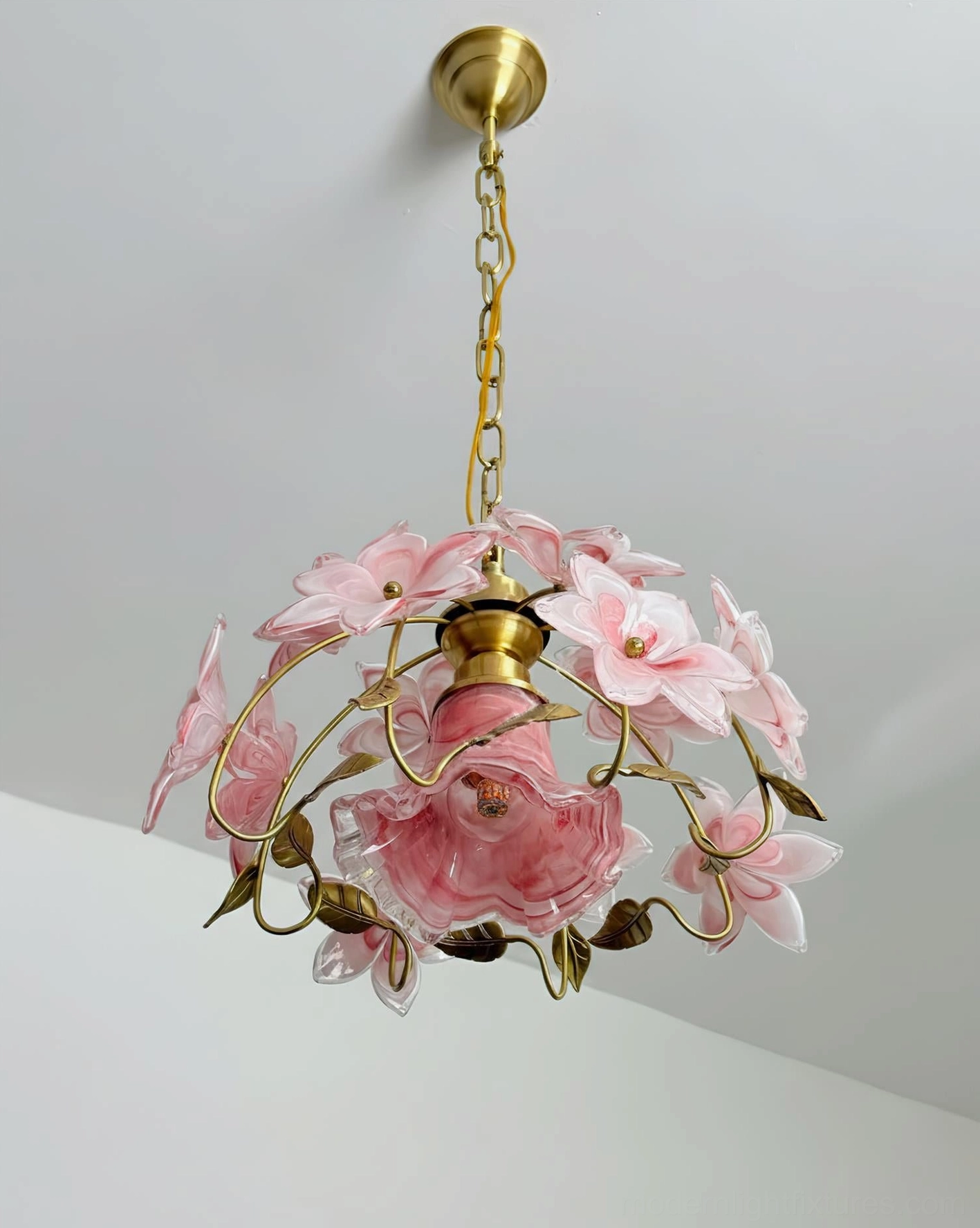 Blossira floral pendant light artistic composition showing translucent pink glass petal arrangement