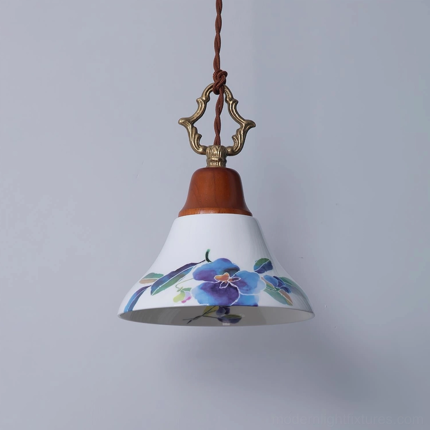 Blue floral ceramic pendant light with purple azalea print, bottom-up three-quarter view showing hardware detail and wooden crown