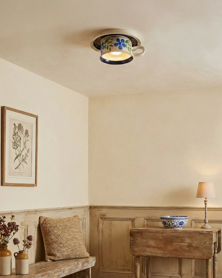 Blue ceramic tea cup ceiling fixture in minimalist entryway with warm neutral walls, rustic wooden furniture and modern aesthetic