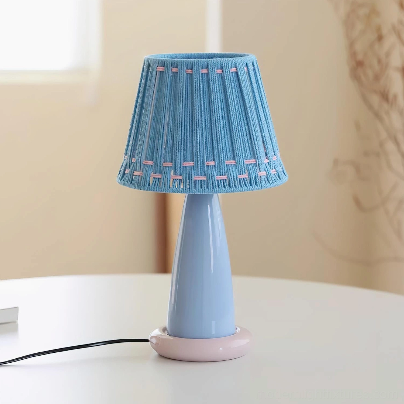 Solid blue ceramic table lamp with hand-stitched woven shade, modern minimalist table lighting for contemporary interiors