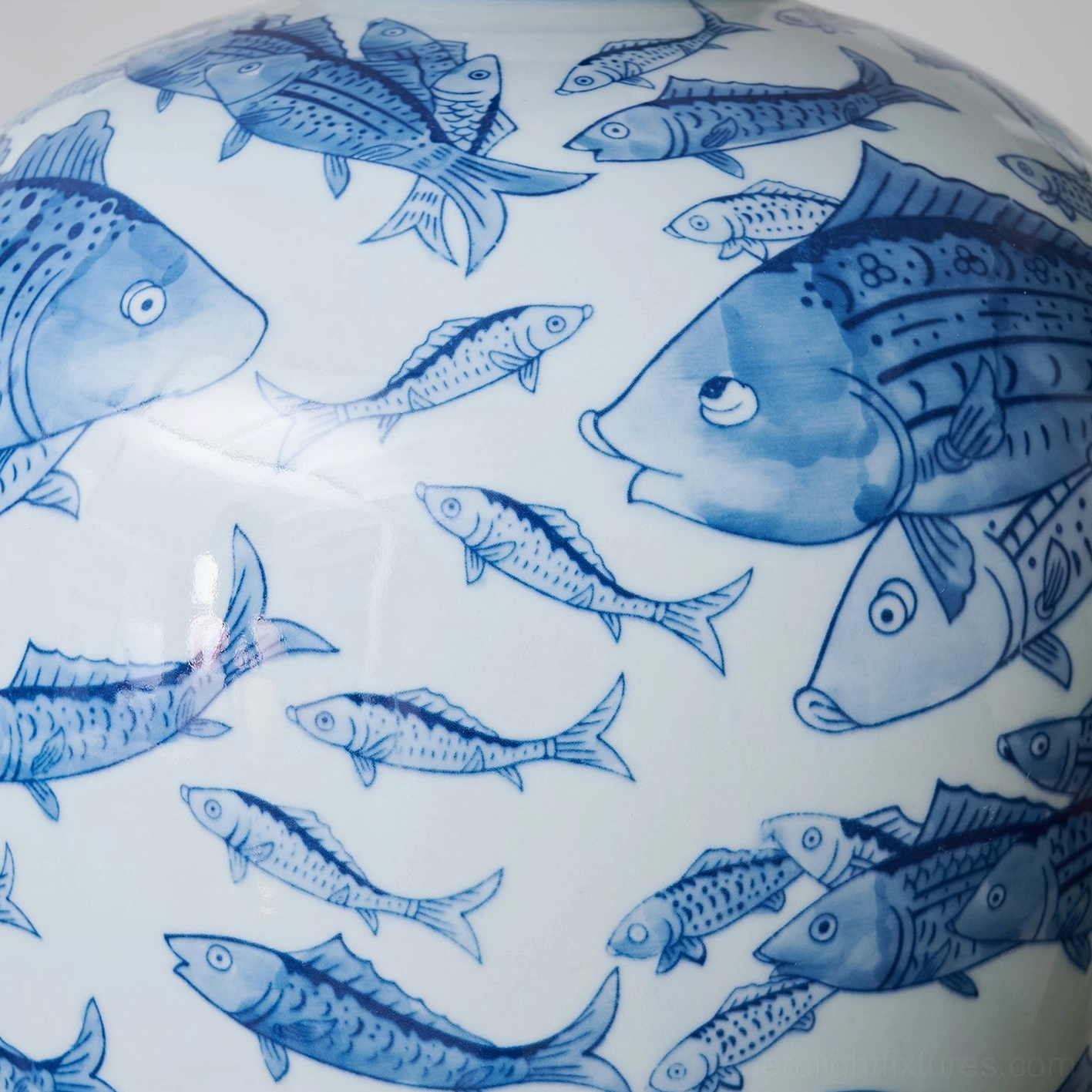 Blue and white decorative ceramic table lamp with hand-painted designs, overhead view of shade and base relationship