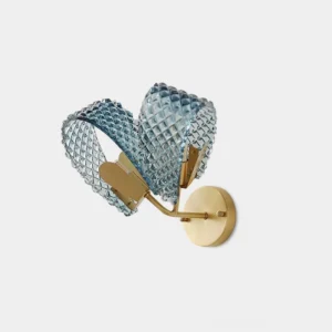 Modern blue crystal wall sconce with brass gold hardware, front overhead view showcasing faceted glass design