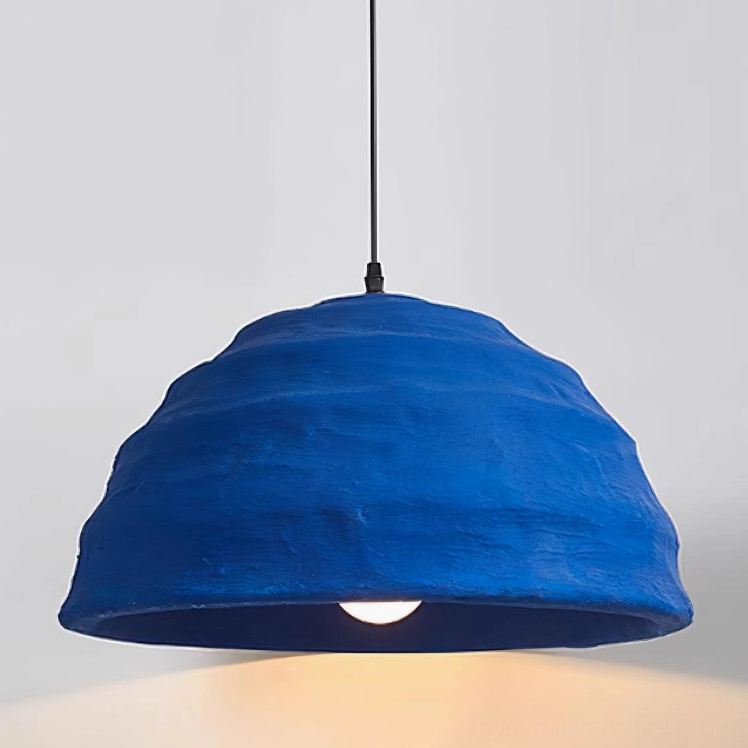 Close-up low angle view of handcrafted blue dome pendant showing detailed wavy ribbed matte finish texture