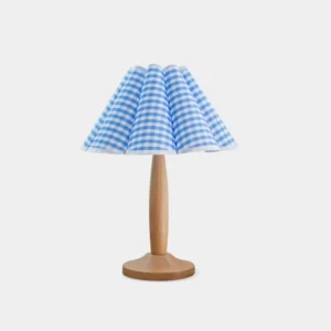Blue gingham pleated table lamp with natural wood base front view, modern farmhouse desk lighting