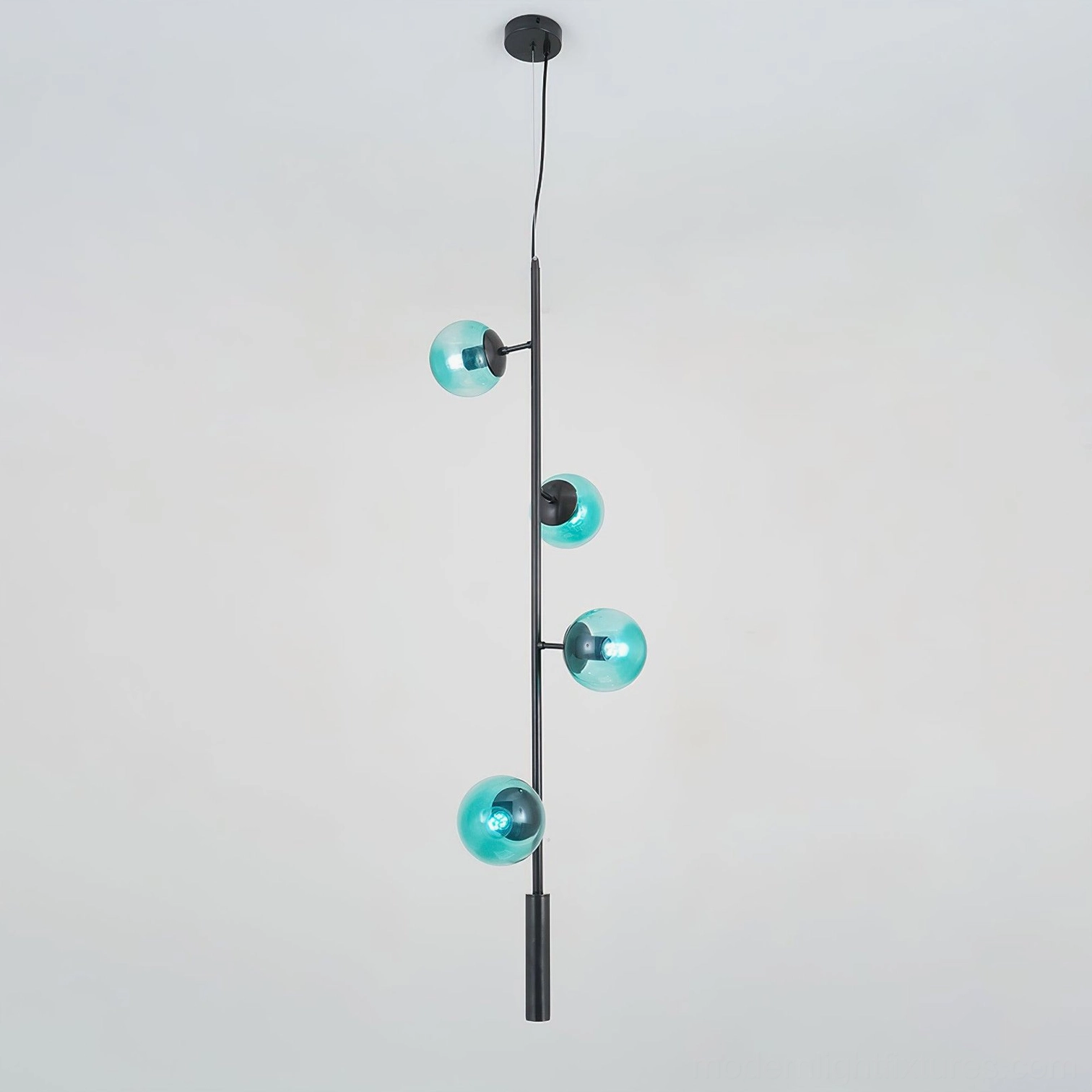 Blue glass orb chandelier creating bold color statement in modern minimalist home