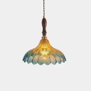 Azure Jewel pendant light with gradient blue glass peacock feather shade and red jewel accents, front studio view
