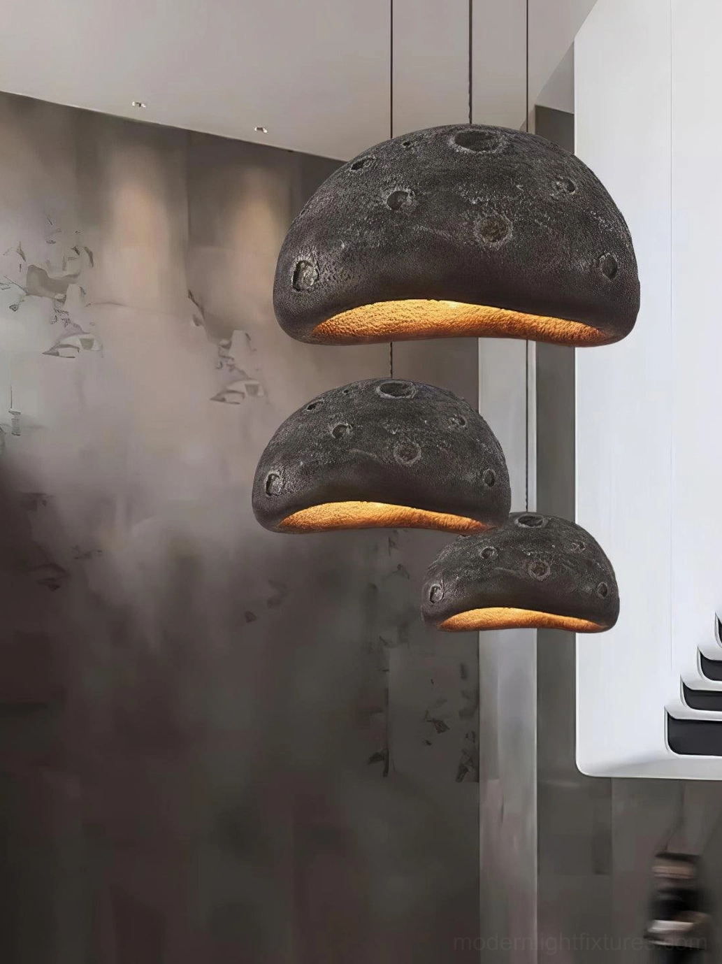 Blue meteorite crater pendant light in bedroom creating soft intimate lighting atmosphere