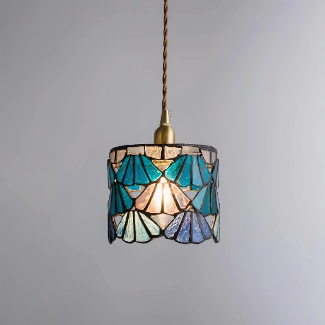 Tina blue and pink stained glass pendant lights shown together in coordinated interior design
