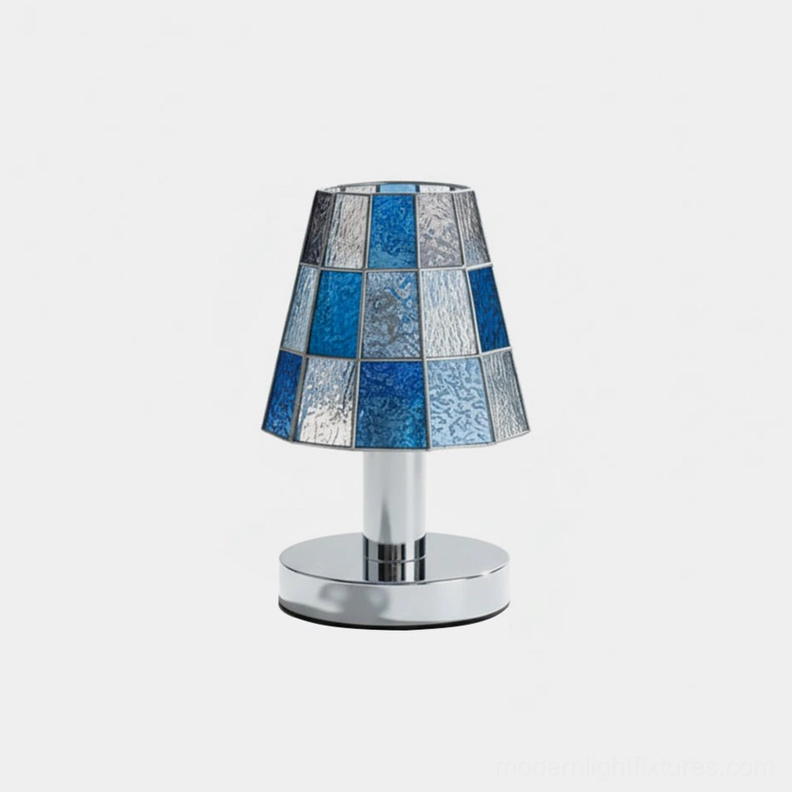Geometric stained glass table lamp with blue checkered shade and polished chrome base, front studio view