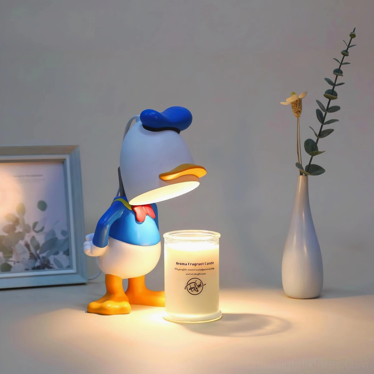 Flameless character candle warmer lamp with blue and white design creating warm ambient lighting in modern bedroom setting