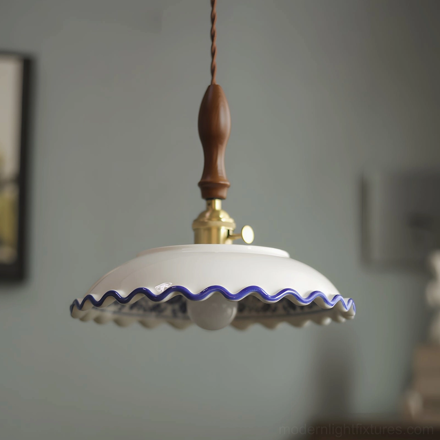 Side profile of Cobalisse blue and white porcelain pendant light showing turned walnut wood canopy, adjustable braided cord, and ceramic rim detail