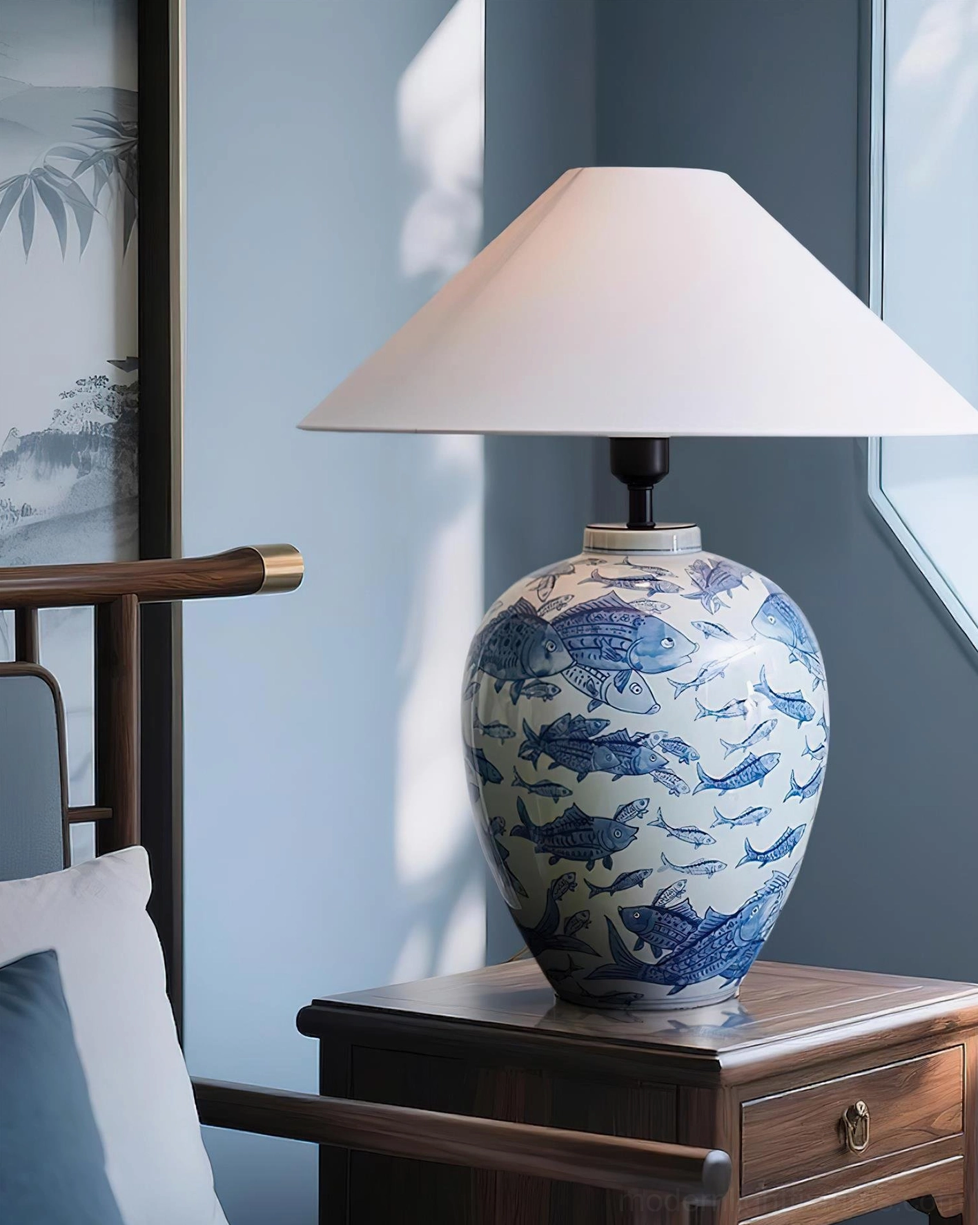 Blue and white ceramic table lamp featuring traditional Chinese porcelain aesthetics with hand-painted details and white fabric shade