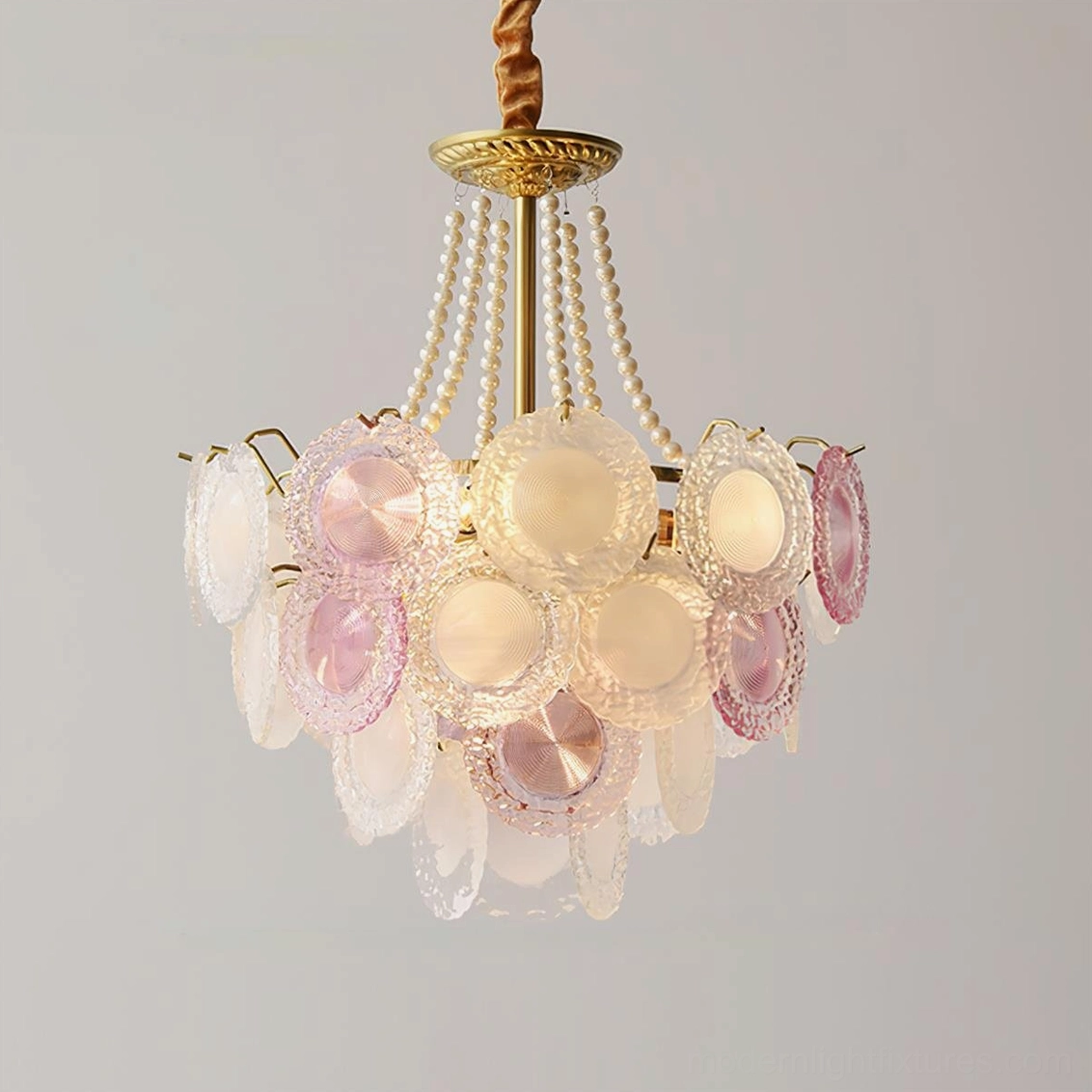 Violaire chandelier angled perspective showing cascading petal glass design with golden brass metal accents