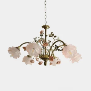Blush pink floral chandelier with antique brass frame on white background, romantic garden-inspired design with delicate rose and vine detailing