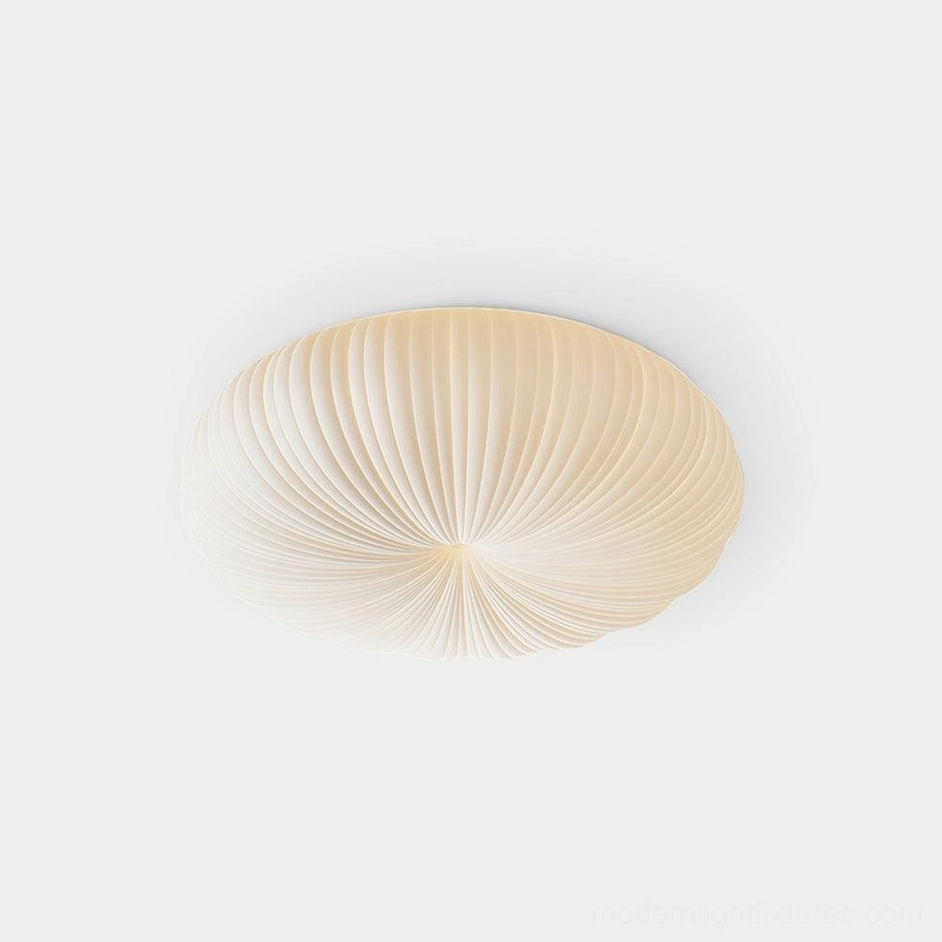 Bobby modern flush mount ceiling light with radial ribbed pleated acrylic diffuser, top-down view showing even light distribution