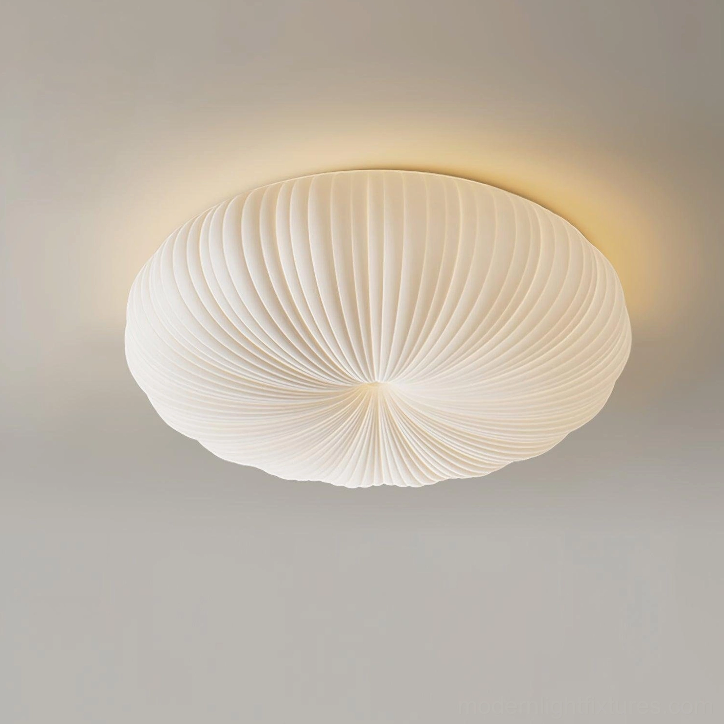 Close-up three-quarter view of Bobby ceiling light fixture showcasing creamy white acrylic surface and radial stripe texture detail