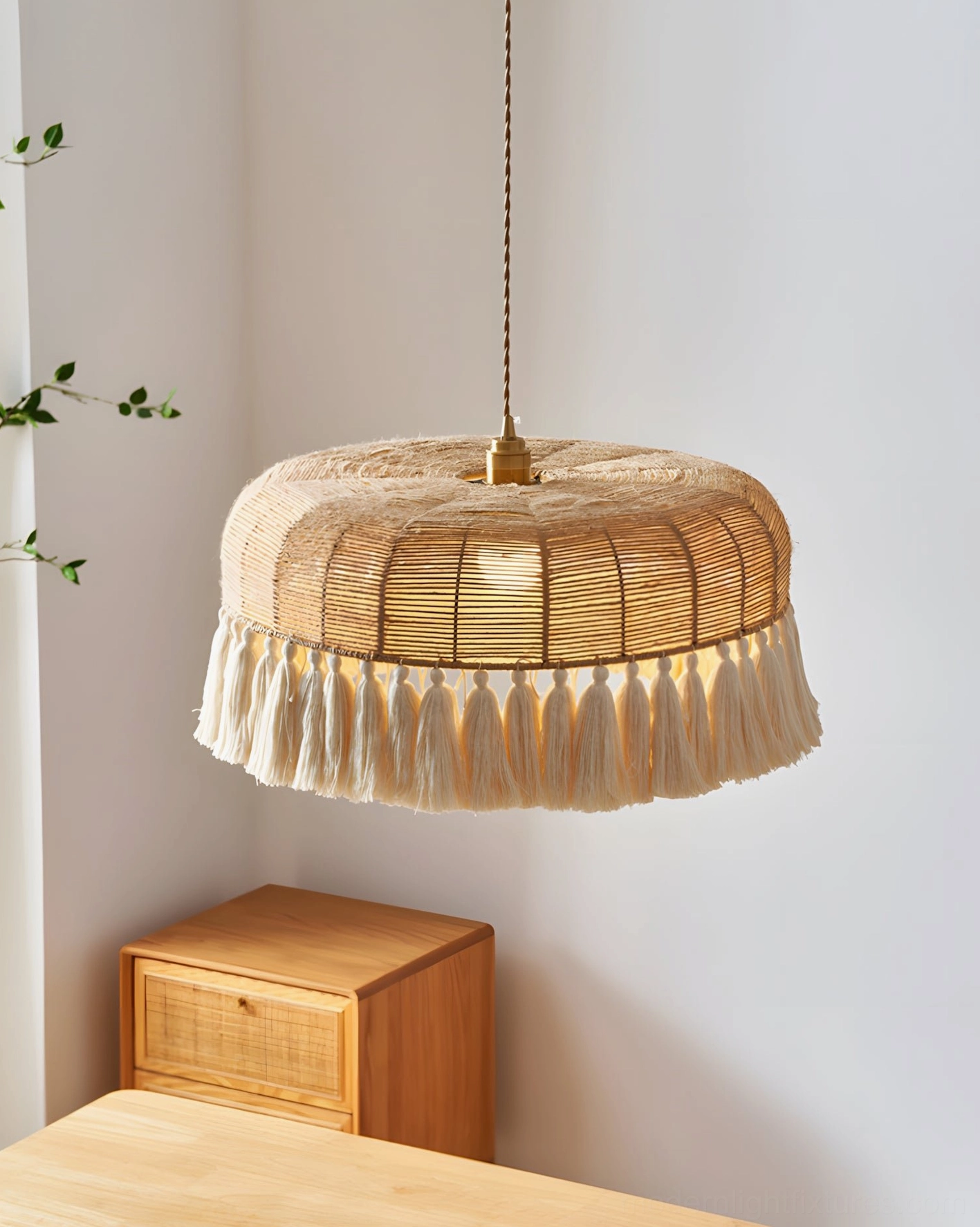 Bohemian rattan pendant lamp styled in dining room with wooden furniture, showcasing warm amber glow and natural texture
