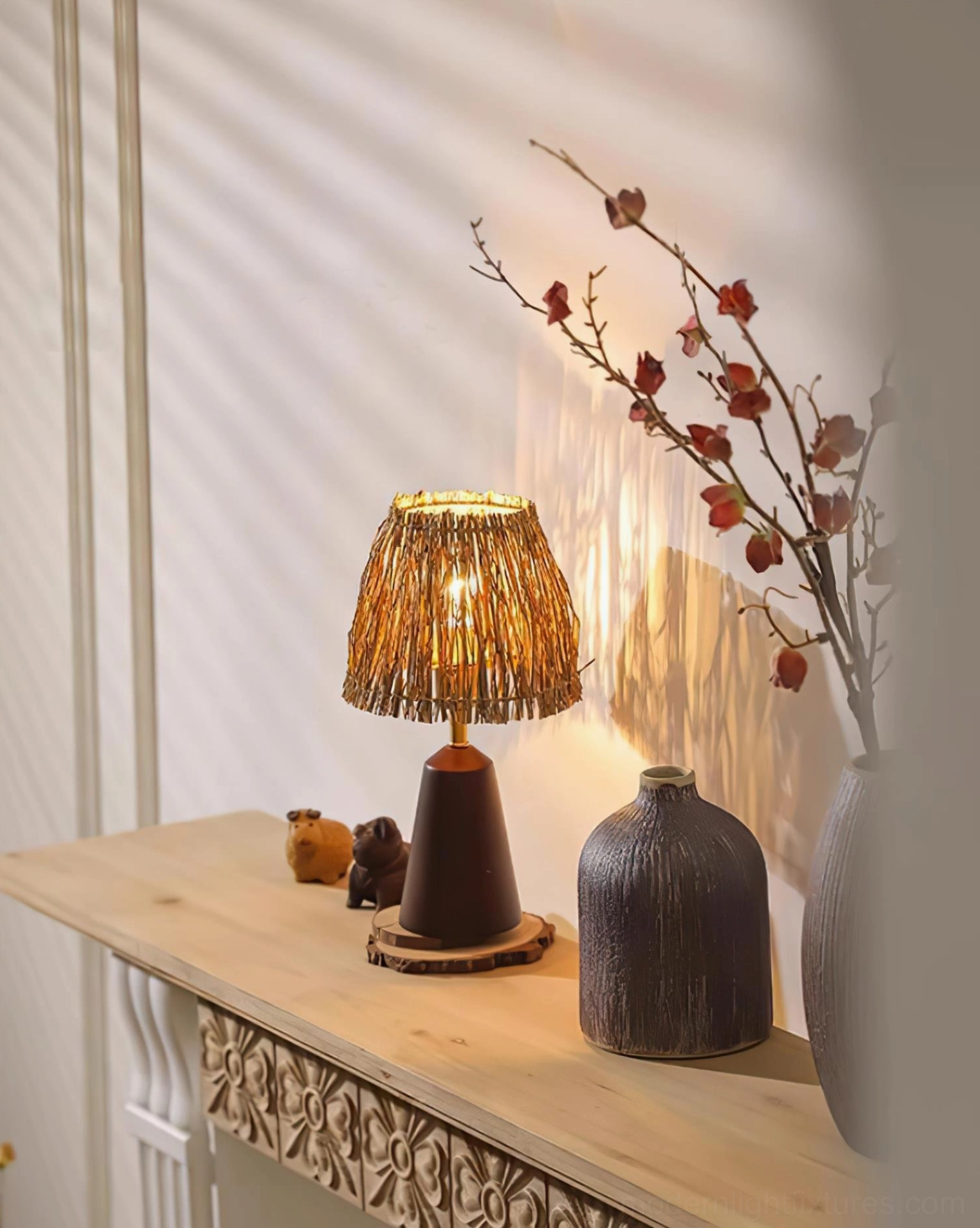 Side angle view of natural wood bohemian table lamp with handwoven straw diffuser