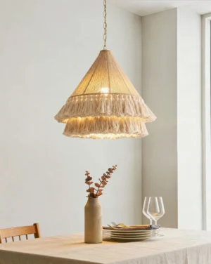 Bohemira bohemian pendant light hanging over dining table in modern farmhouse interior with warm white lighting and natural textures