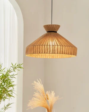 Tera Weave pendant light hanging in bohemian home interior with green plants and pampas grass, warm glowing wabi-sabi aesthetic