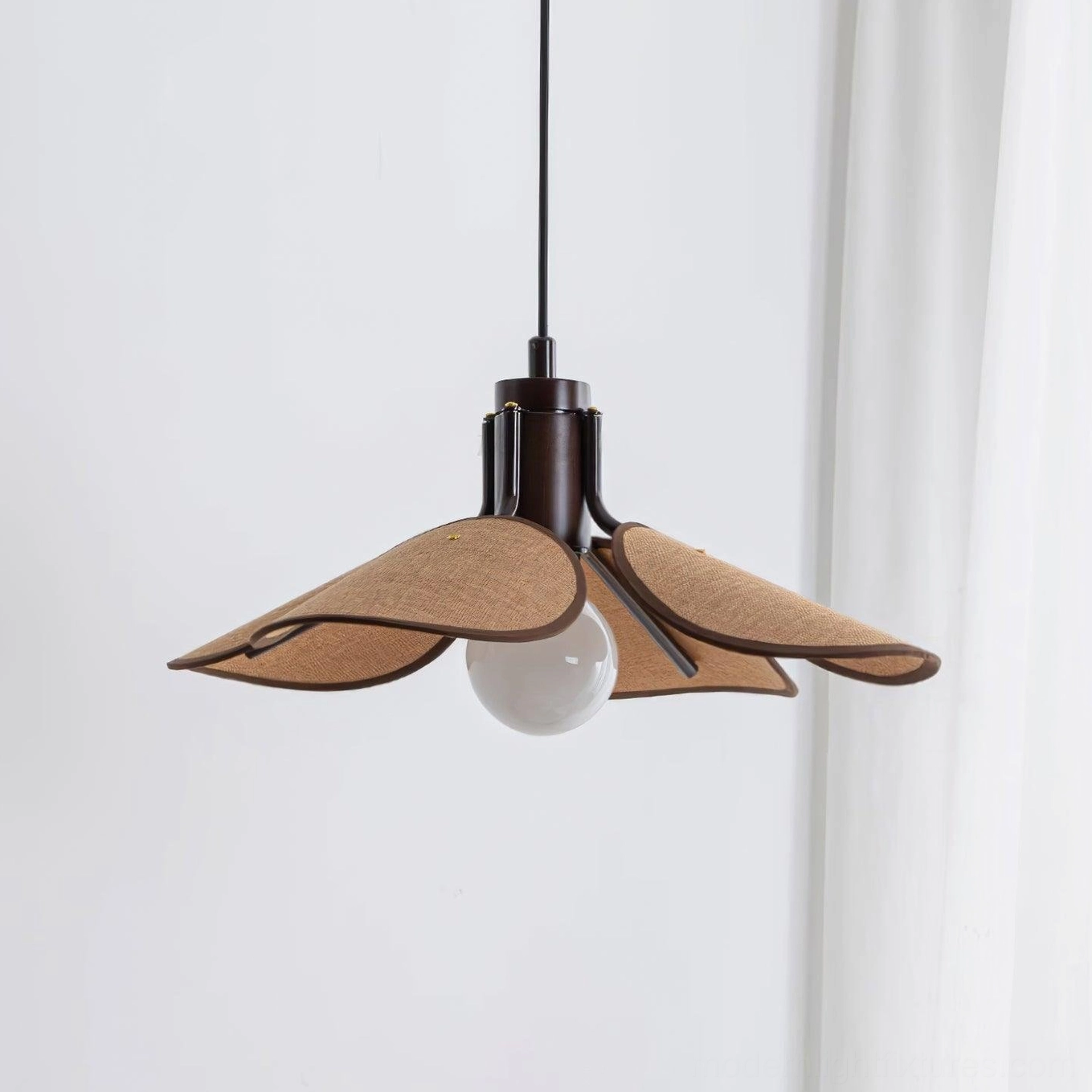 Boho rattan pendant lamp suspended over kitchen island with pendant lighting for task and ambient use