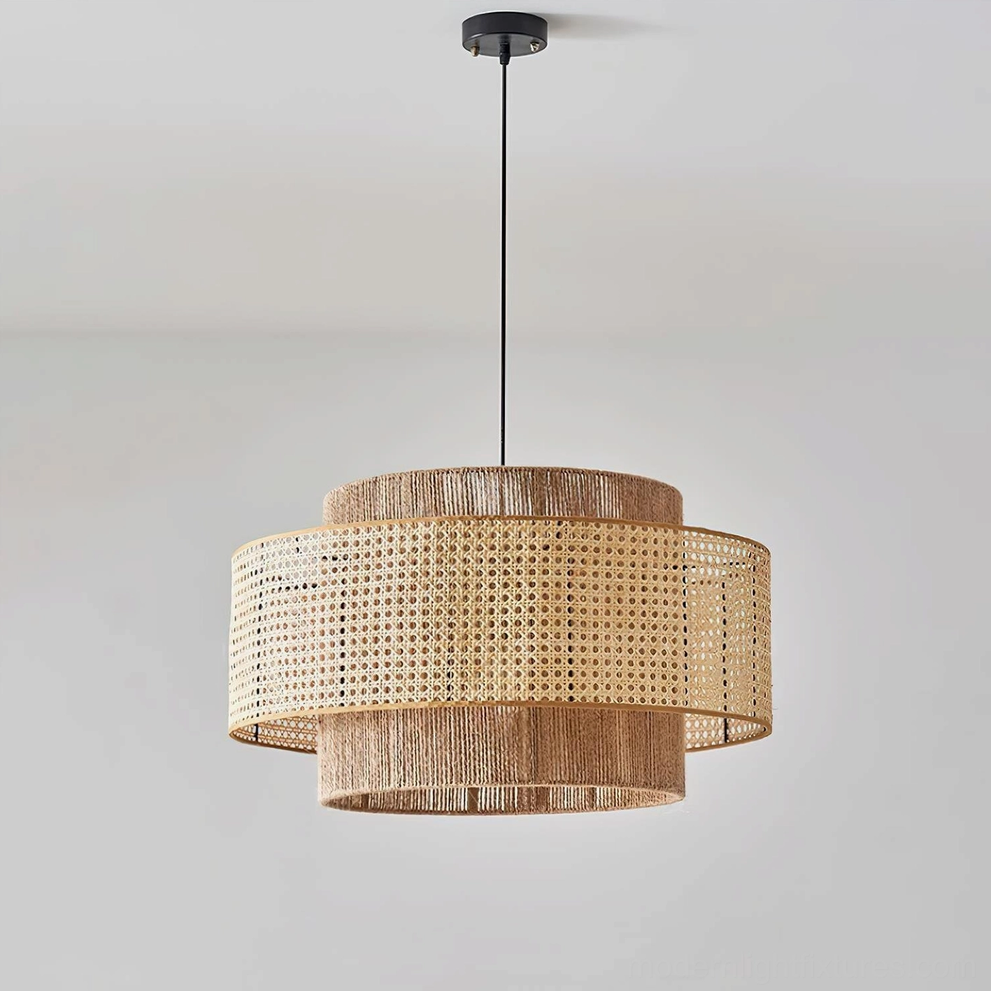 Modern boho rattan pendant light installation detail, showing metal hardware and hemp rope suspension system