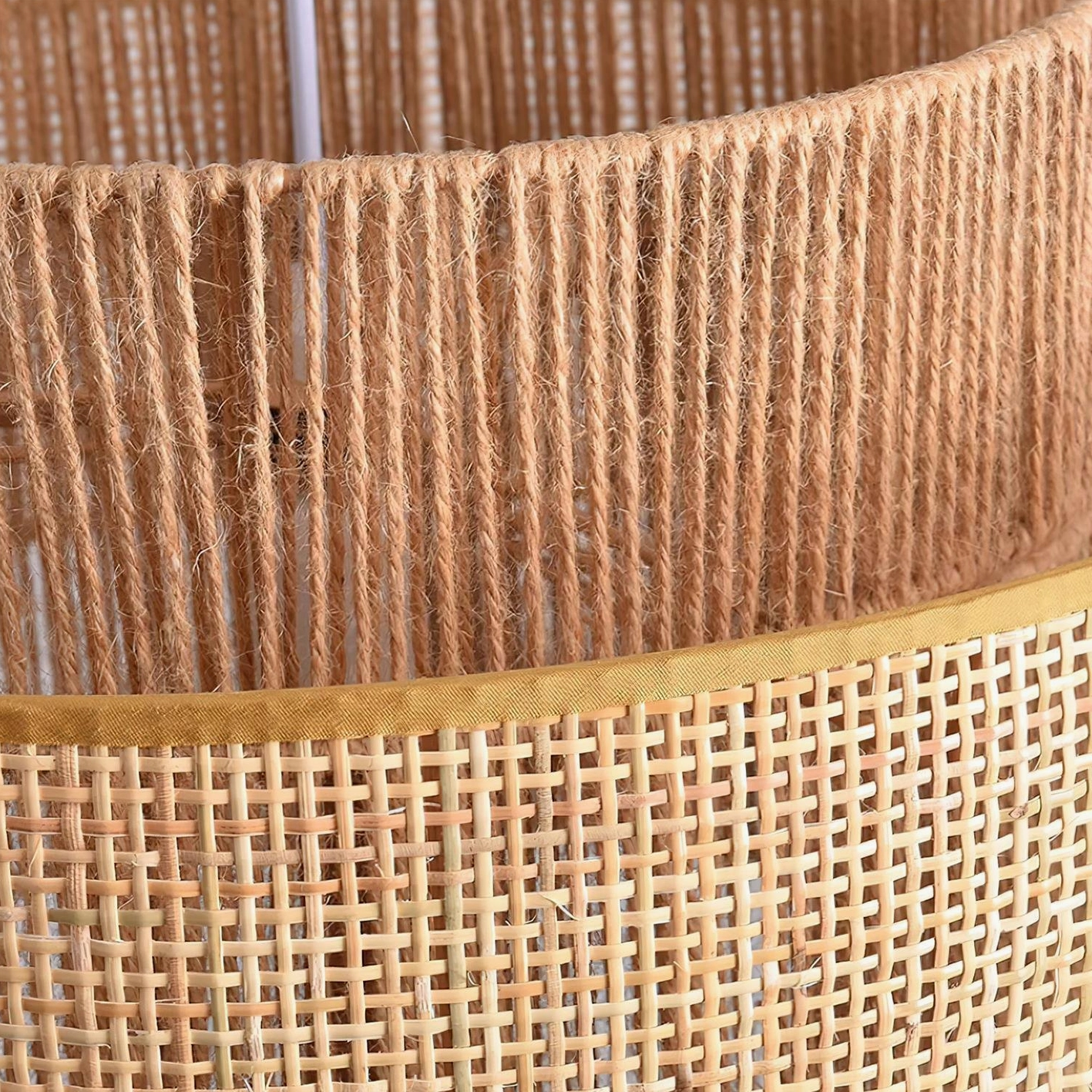 Boho rattan weaving pendant light providing warm ambient lighting over dining or workspace surface