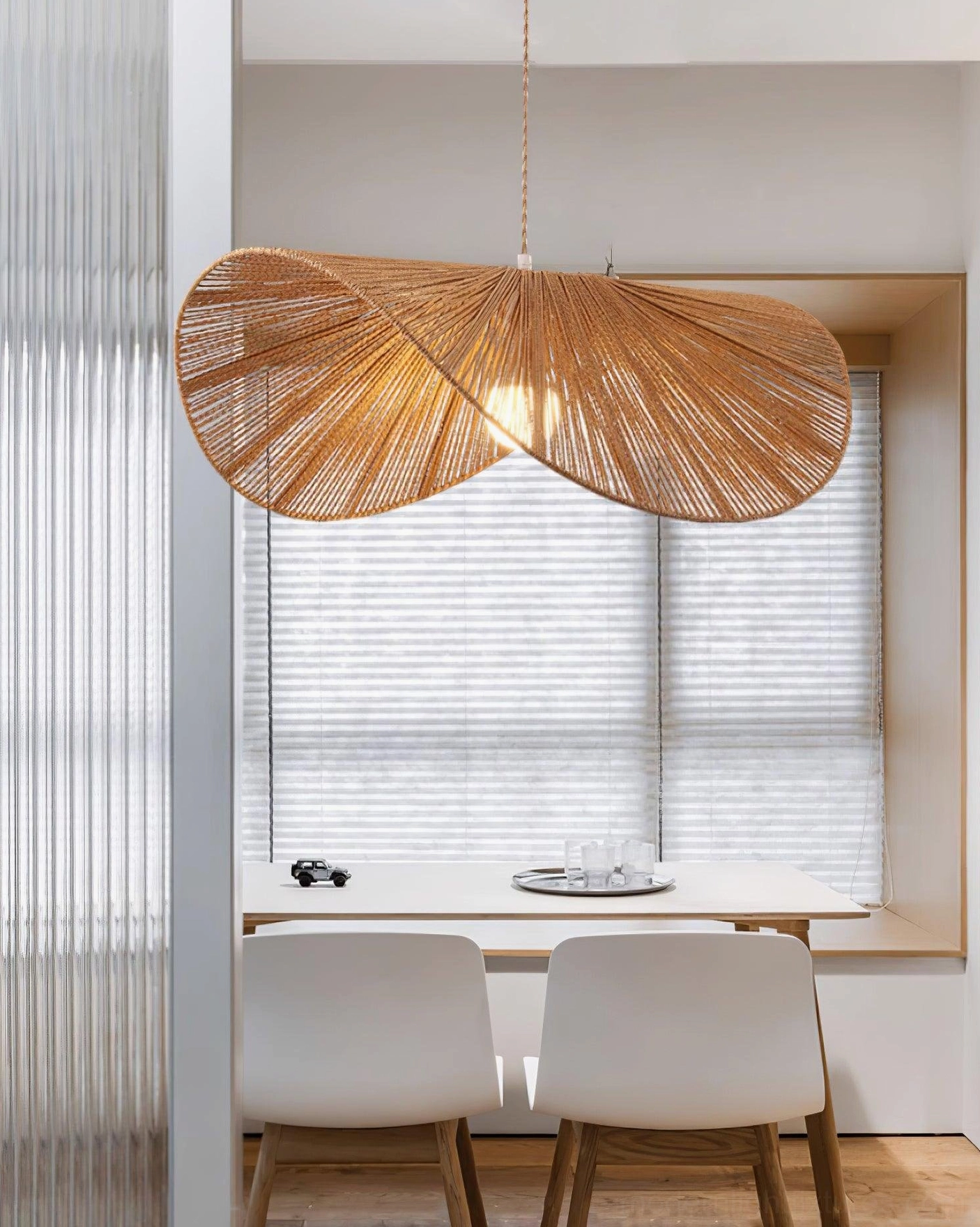 Natural fiber woven rope straw hat pendant light in eclectic bohemian interior design space