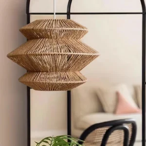 Modern boho woven pendant light with three-layer geometric design, photographed in contemporary living room with black furniture