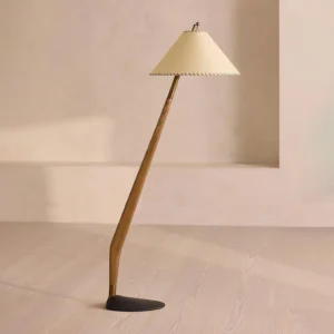 Curved wooden arc floor lamp with walnut finish in minimalist room setting, side perspective showing elegant stem and warm ambient lighting