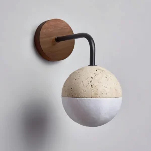 Bolle modern wall sconce with beige travertine sphere and black articulating arm architectural detail
