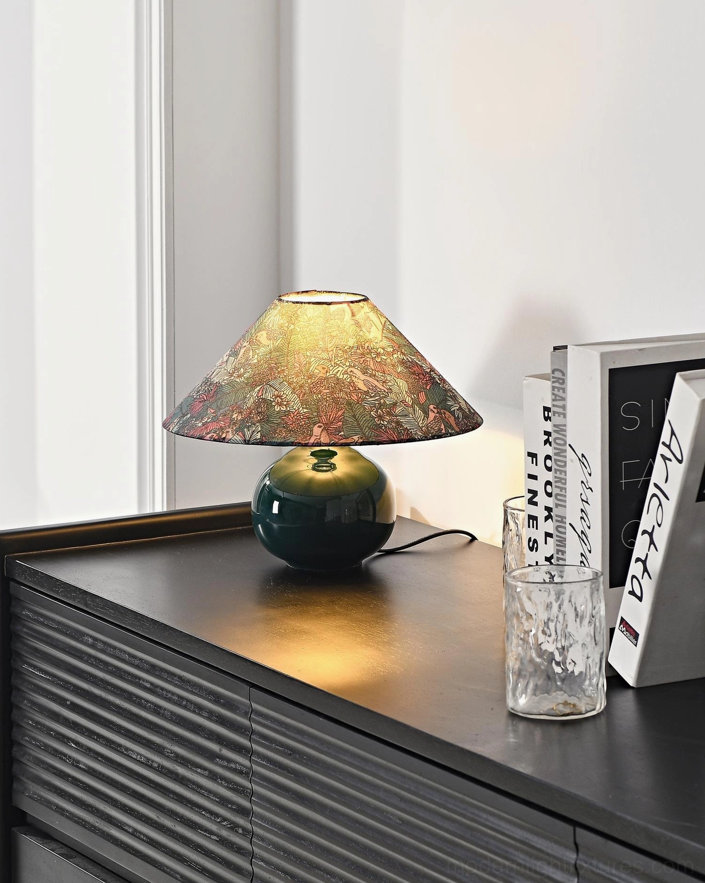 Forest green botanical ceramic table lamp featuring intricate wildlife and botanical pattern on fabric shade for modern interiors