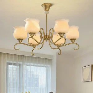 Illuminated multi-head bloom chandelier with curved brass arms in residential living room