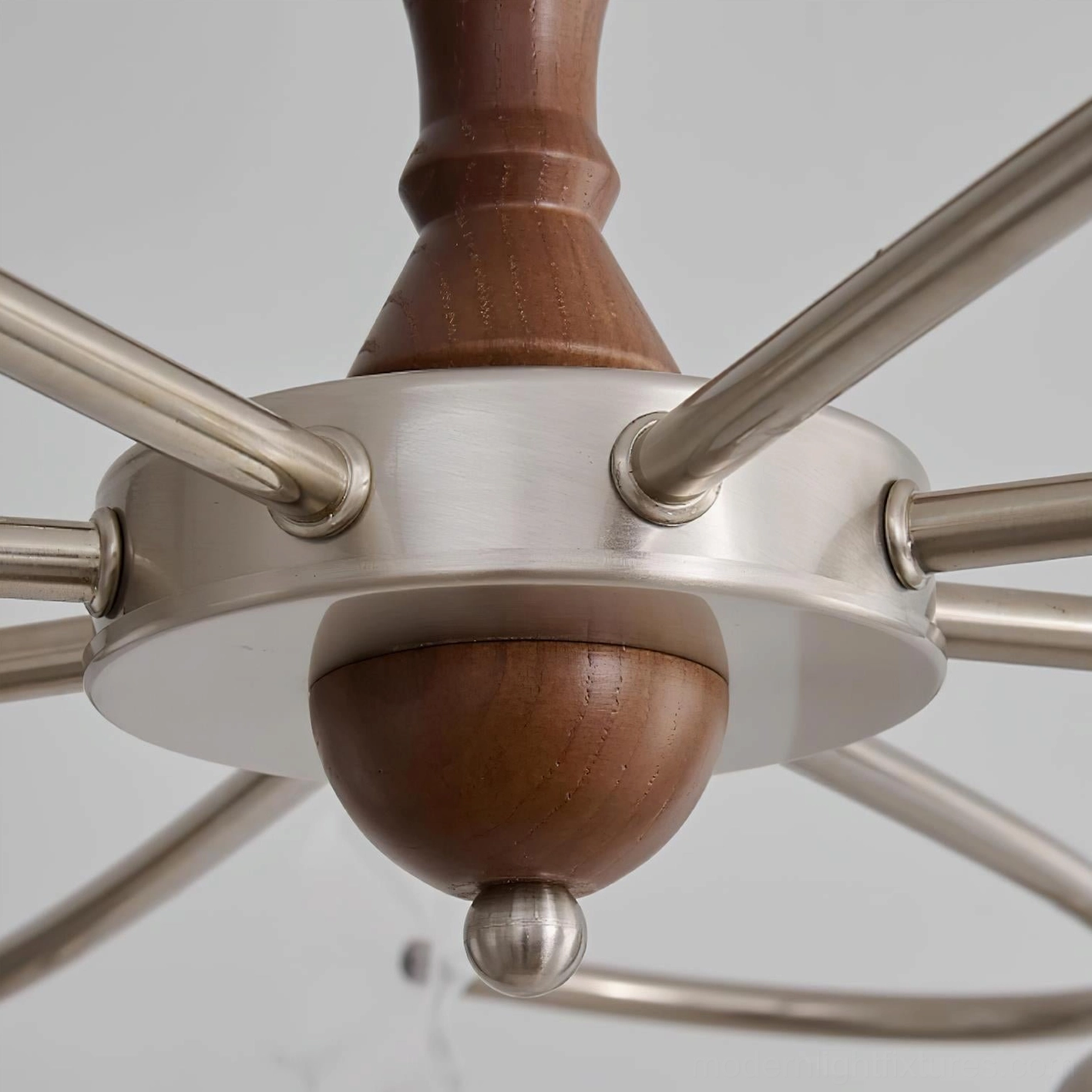 Botanical glass chandelier with decorative wood stem and brushed metal frame in neutral interior