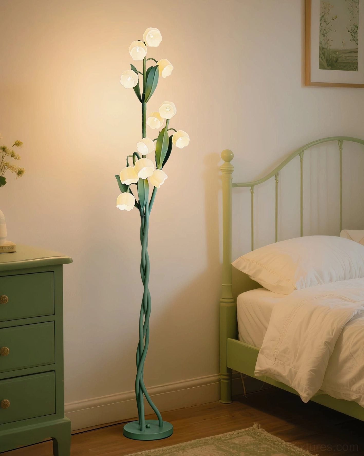 Three-light botanical floor lamp illuminating cozy bedroom with lit green iron bed and dresser, ambient evening lighting