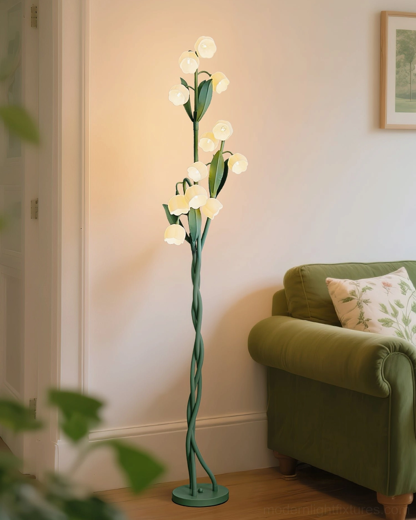 Modern botanical floor lamp in styled interior showing integration with furniture and decorative elements