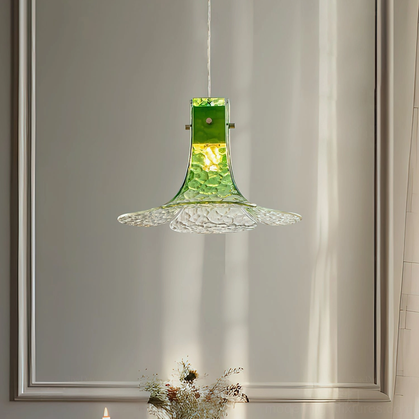 Decorative glass pendant light in minimalist entryway creating soft shadow patterns on walls
